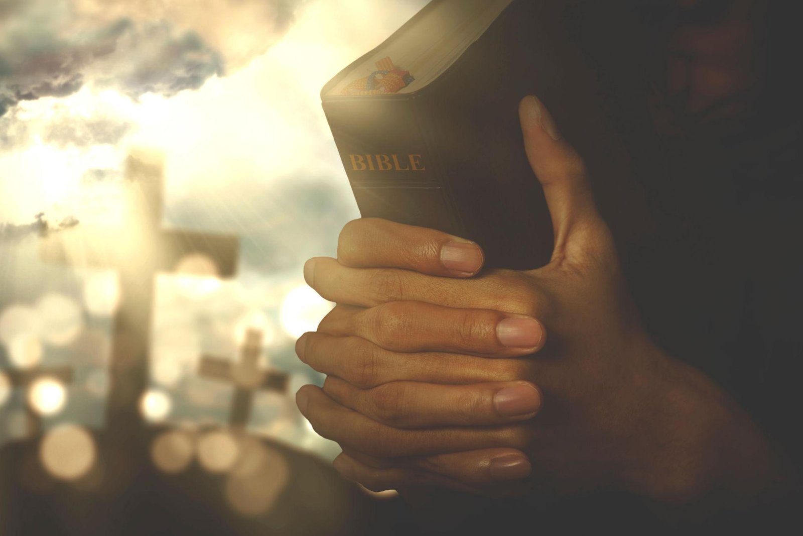 Christian believer praying with Bible at sunrise, representing faith-filled Christian living.