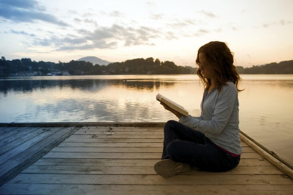 Christian woman reading the Bible during morning devotion, representing womanhood Bible verses.