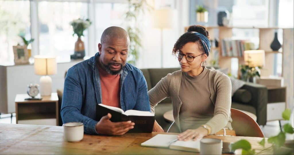 Christian husband and wife reading the Bible together