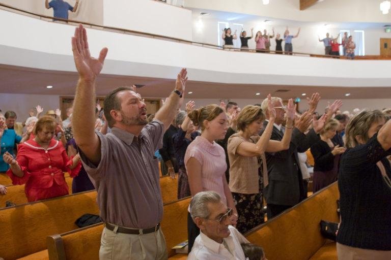 Christian congregation worshipping together in church