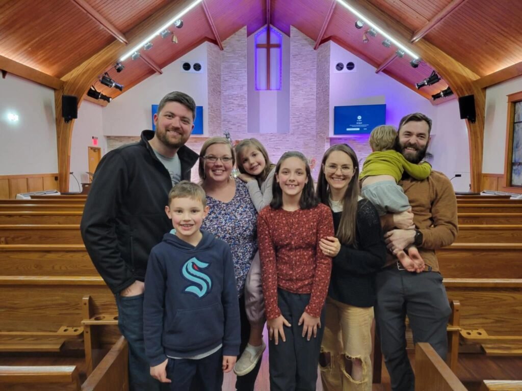 Happy Christian family attending church