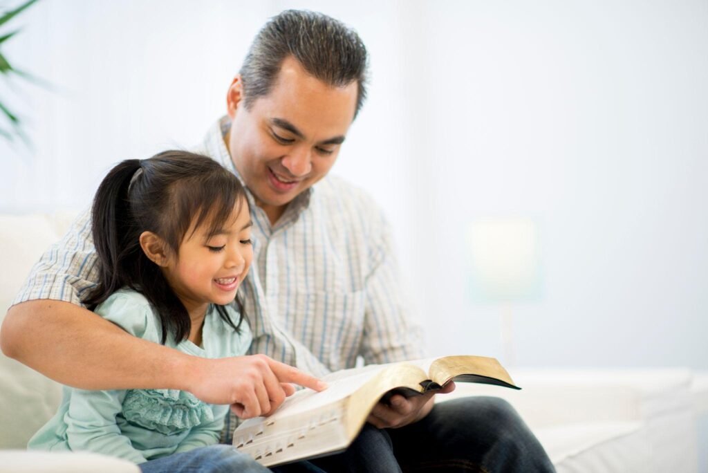 Christian family praying together at home