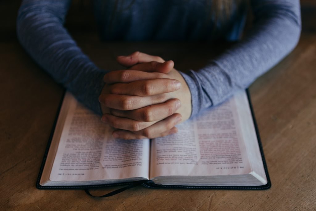 Open Bible and prayer during difficult times