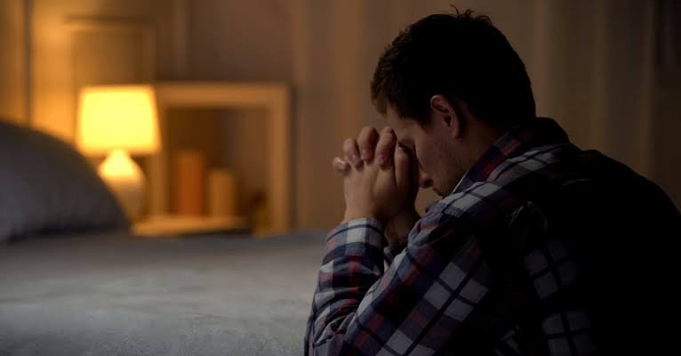 Christian praying for strength during difficult times